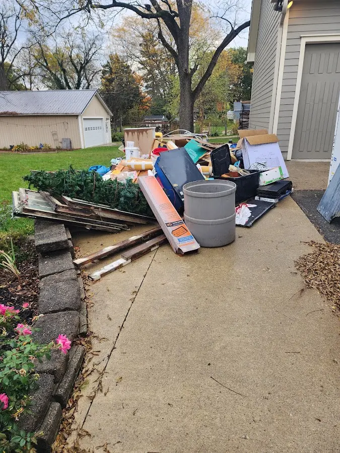 Dumpster being loaded with debris for Roofing Dumpster Rental in Ramona